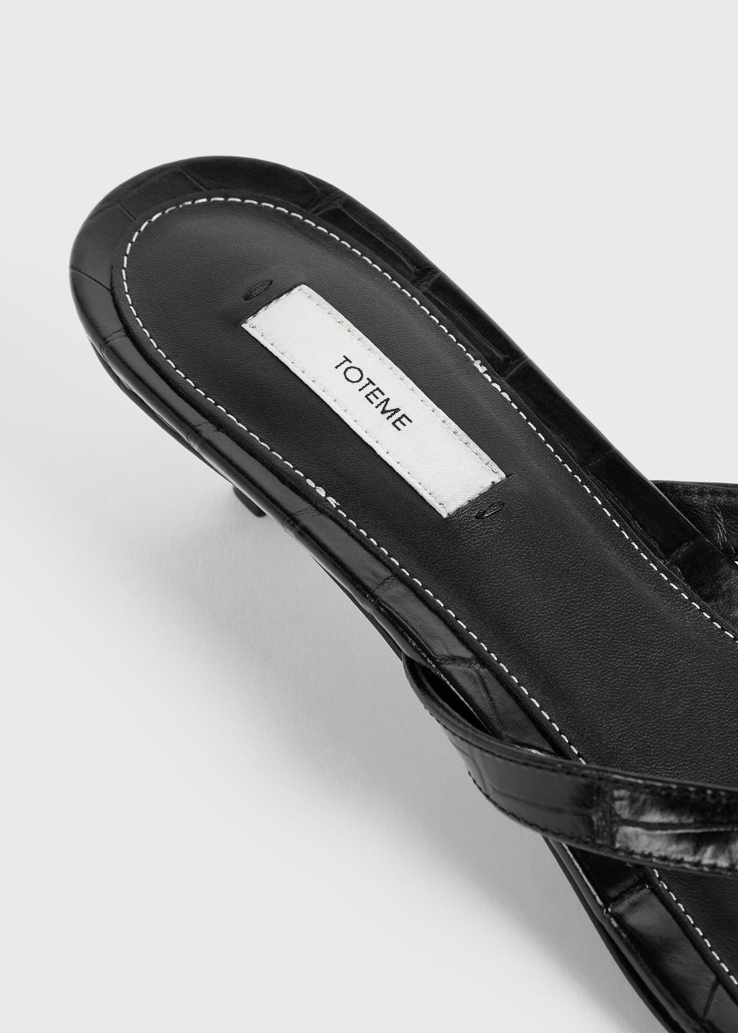 Croco-embossed heeled flip flops black