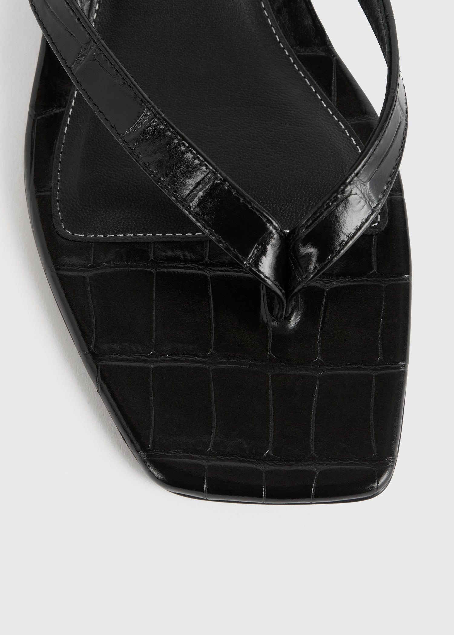 Croco-embossed heeled flip flops black